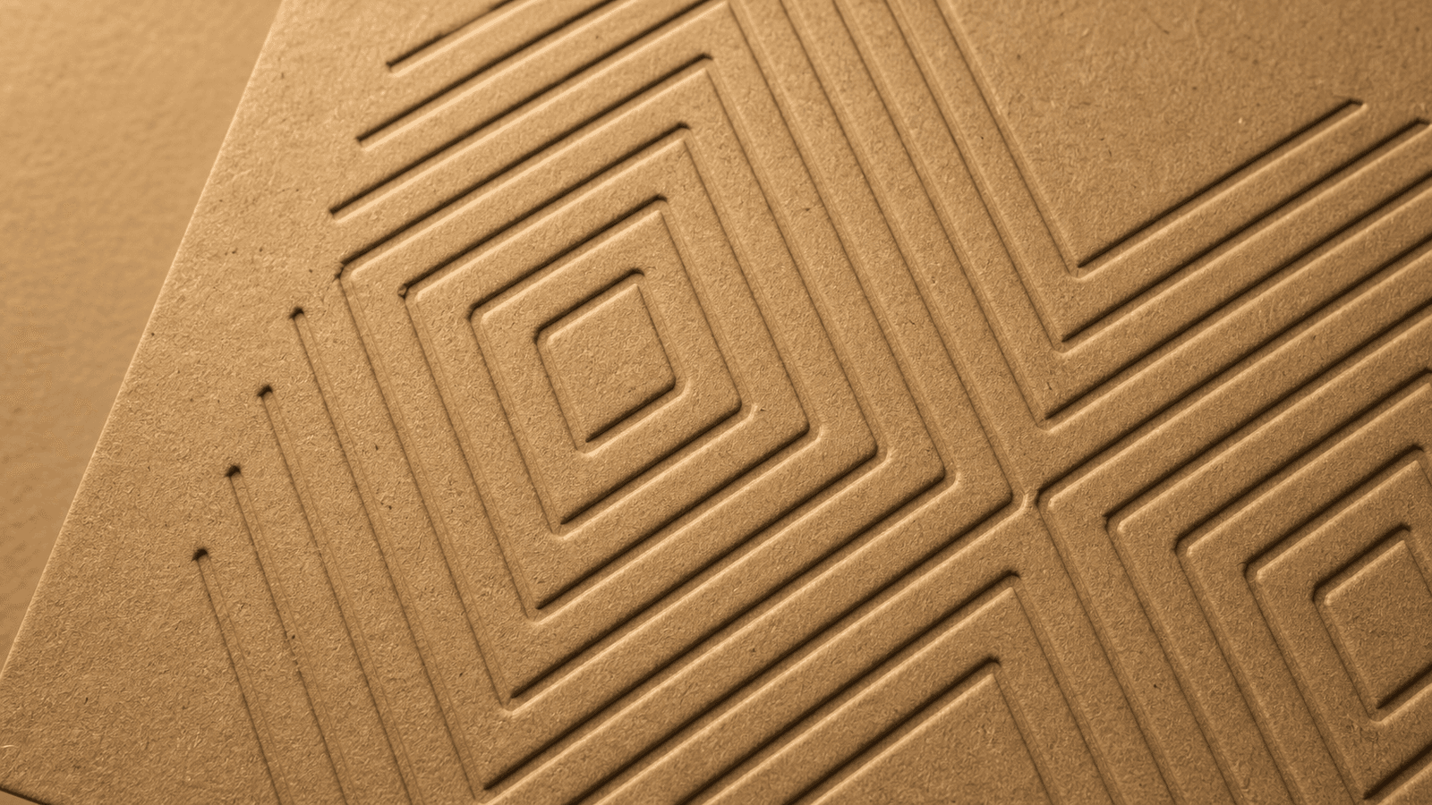 Recessed debossed pattern on kraft paperboard