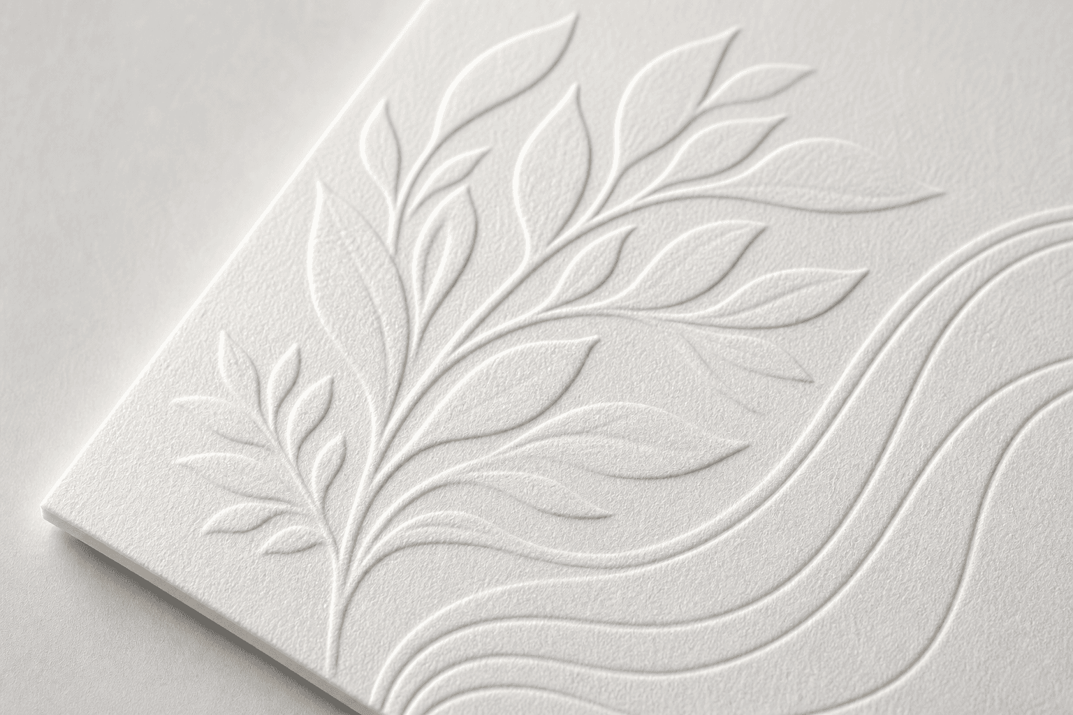 Raised embossed pattern on white luxury paperboard